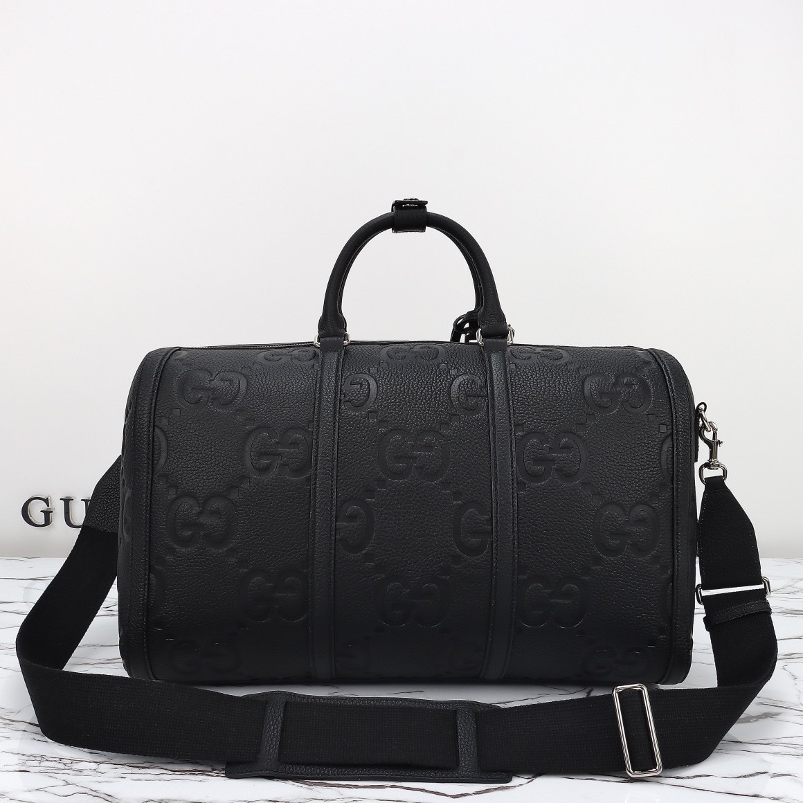 Gucci GG Embossed Duffle Bag — 725282