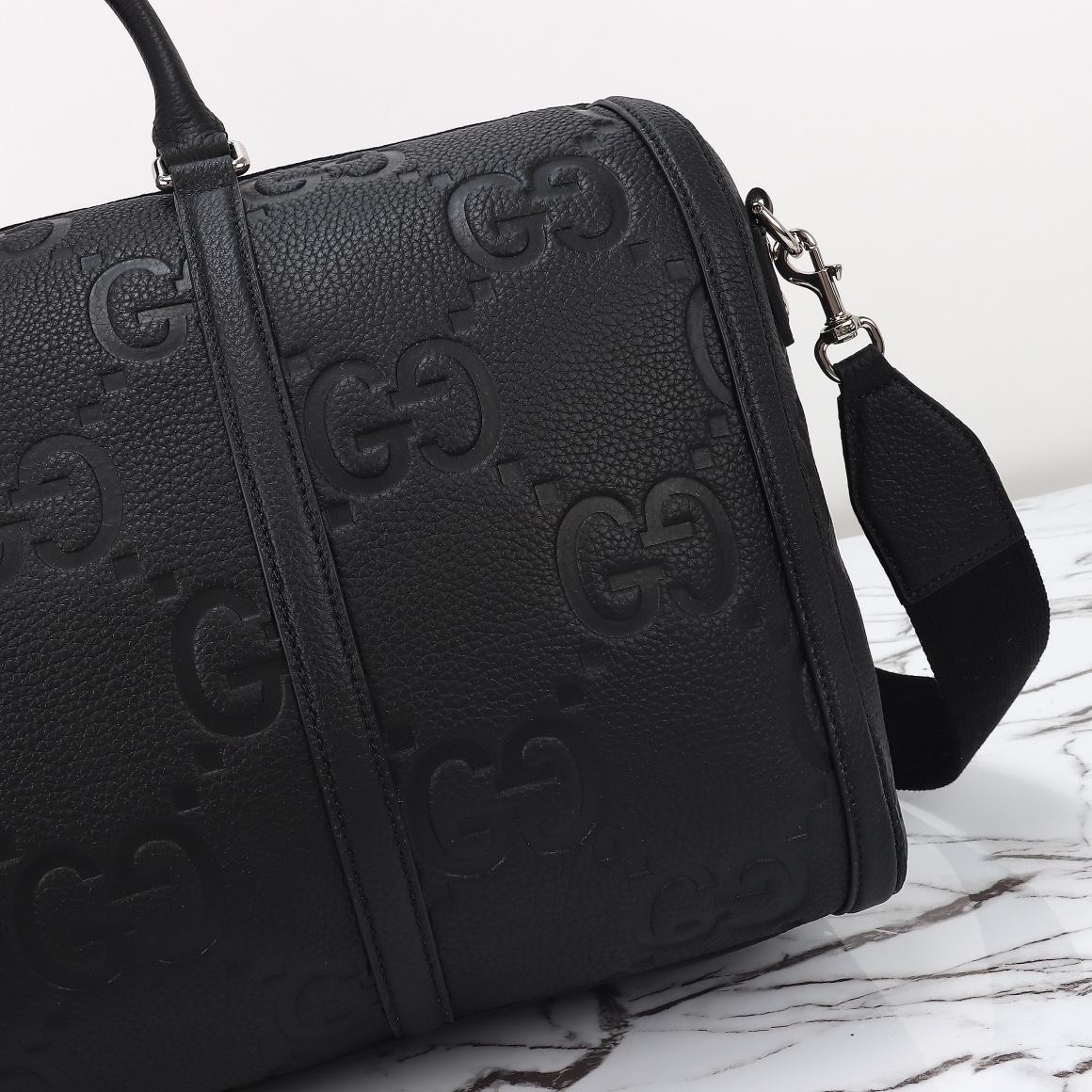Gucci GG Embossed Duffle Bag — 725282