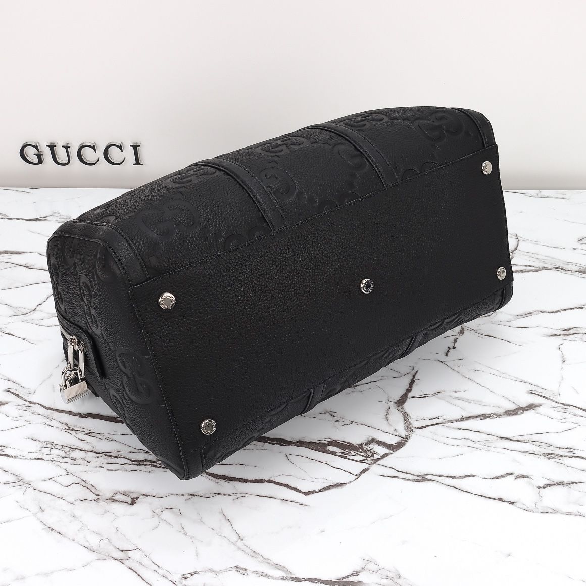 Gucci GG Embossed Duffle Bag — 725282