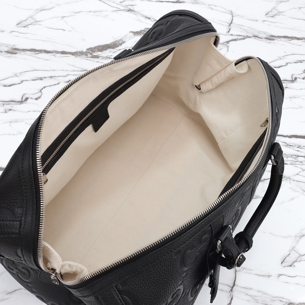Gucci GG Embossed Duffle Bag — 725282